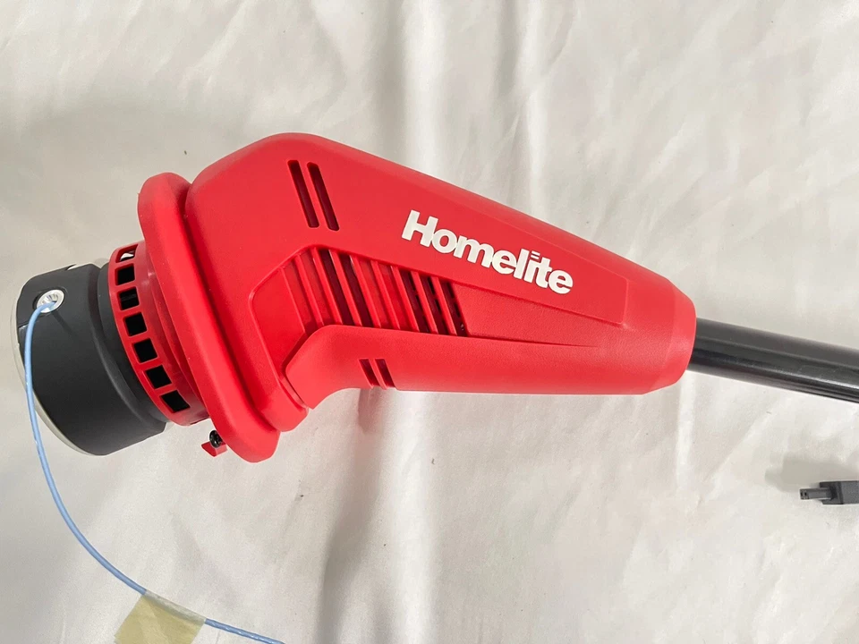 Recortadora/bordeadora de cuerdas Homelite 10" 12V Li-Ion con batería interna de 2,5 Ah + cargador Foto 2 de 4