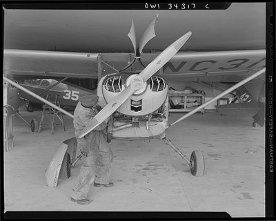 Bar Harbor Maine 1943 Civil Air Patrol ground crew checking patrol plane