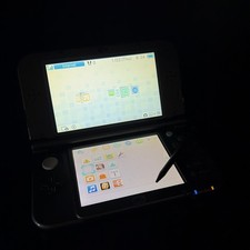 New 3DS XL/LL Black with stylus, case, and 32gb Sandisk SD card