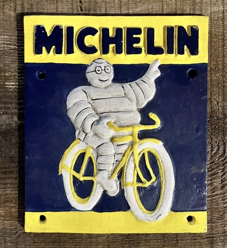 Michelin Man Bibendum on a Bicycle, 1949, Cast Iron Wall Sign, 7.75” x 6.5”