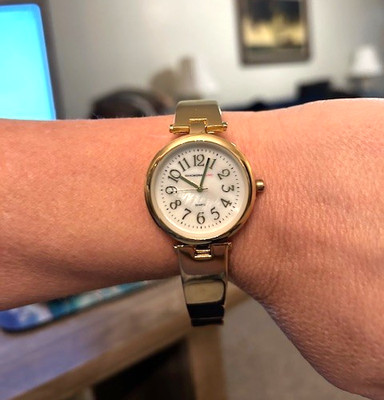 Isaac Mizrahi Live women s gold tone bangle wristwatch with mother of pearl face