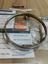 SUZUKI GT250 X7 GT200 X5 SB200 GS400 GS425 NOS HEADLIGHT RIM PT 35111-44030 NICE