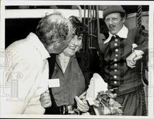 1957 Press Photo Mayflower Commander Villiers kisses wife in Provincetown, MA.