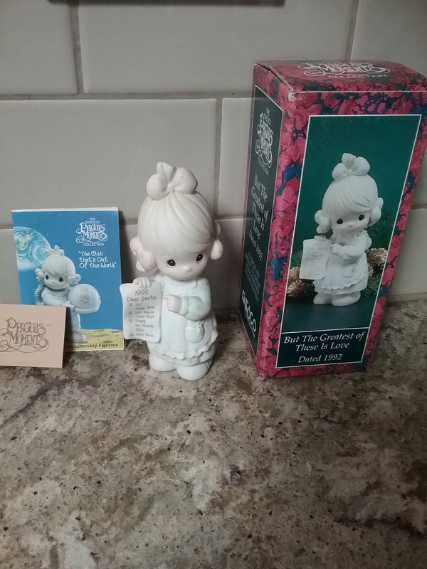 Precious Moments Figurine "But The Greatest Of These Is Love" Date 1992 on Front