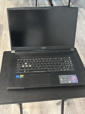 MSI Gaming Laptop with Razor Basilisk x Hyper Speed mouse and Razor mousepad