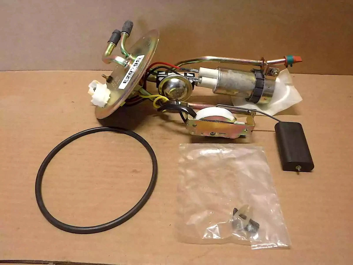 An Airtex electric fuel pump displayed on a sheet of corrugated cardboard.