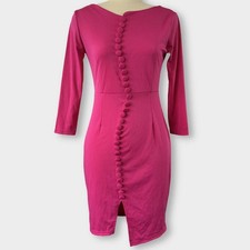 Saturated raspberry pink bodycon dress with a sculptural twist. 