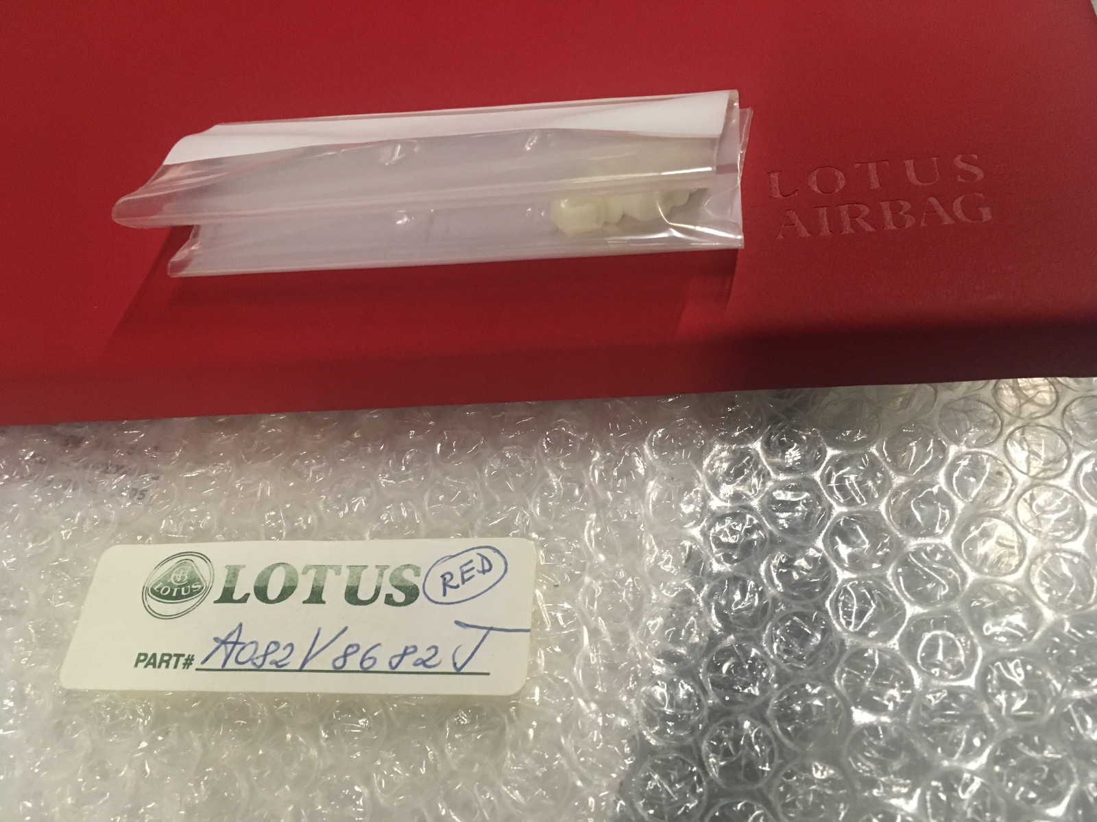 Lotus Esprit S4 / S4S NOS factory red leather passenger SIR cover A082V8682J