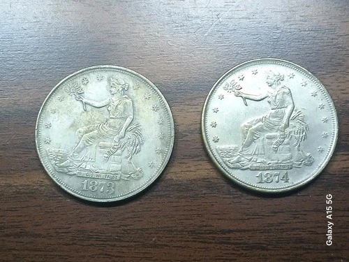 Souvenir Copies Only- Lot of (2) 1873, 1874 United States Trade Dollar.