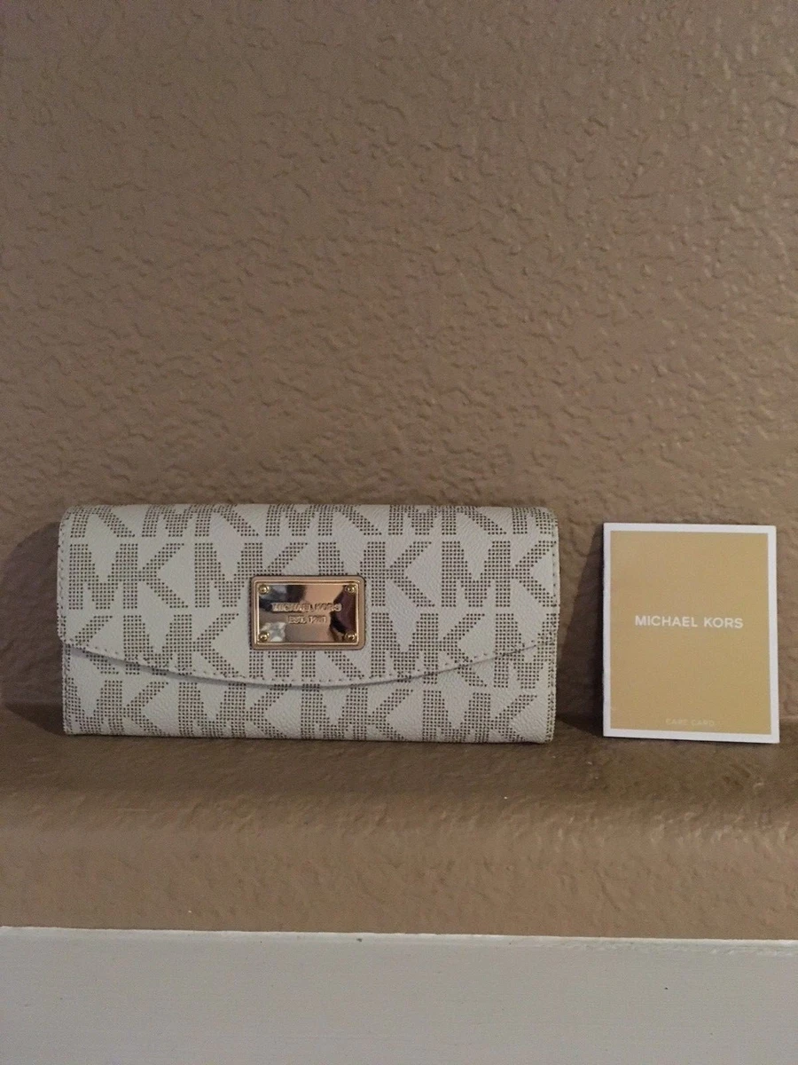 Monogram michael kors wallet hotsell