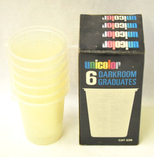 Unicolor quantity of 6 Cat. 336 5 ounce darkroom graduates. New old stock.