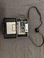 Automatic 250 land polaroid camera. Comes with accessories, film, untested