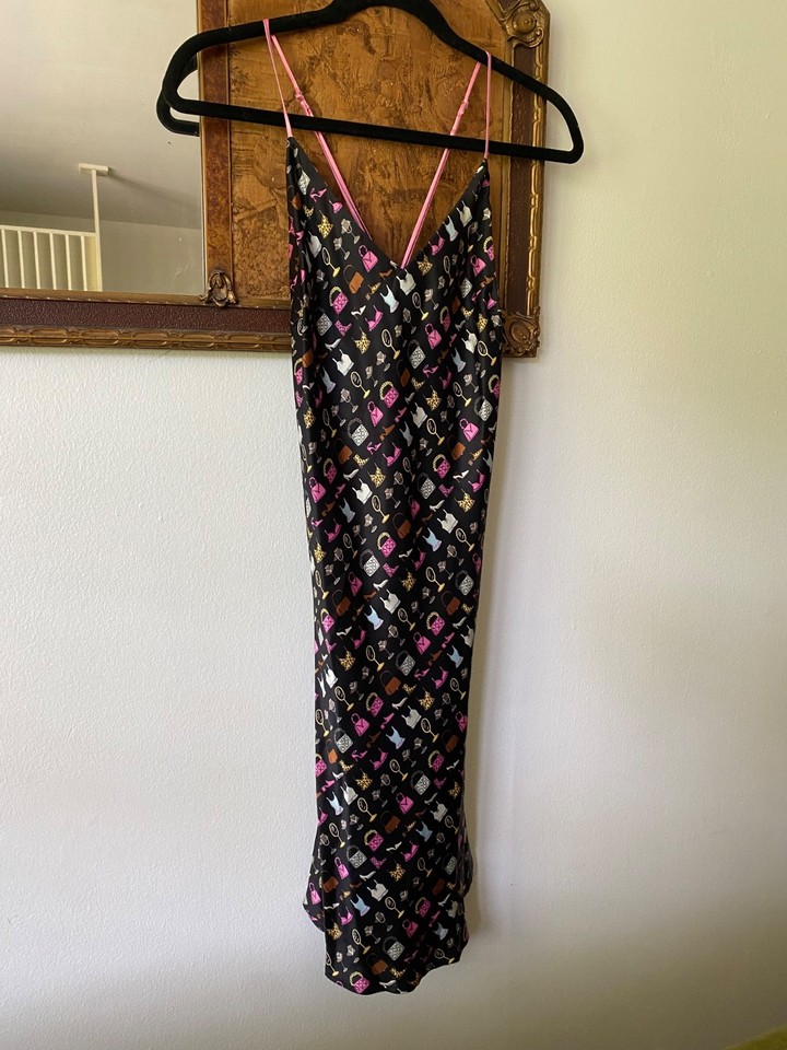 Y2K silk slip dress with an all-over shoe and handbag print — the kind of deliriously fun fashion that defines the era.