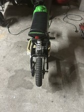 Black Green Seated Electric Scooter with Suspension and Electric Motor