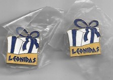 lot de 2 pin's chocolat leonidas (neufs)