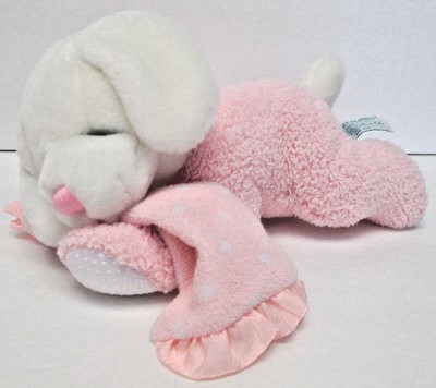 pink dog toy that sticks tongue out