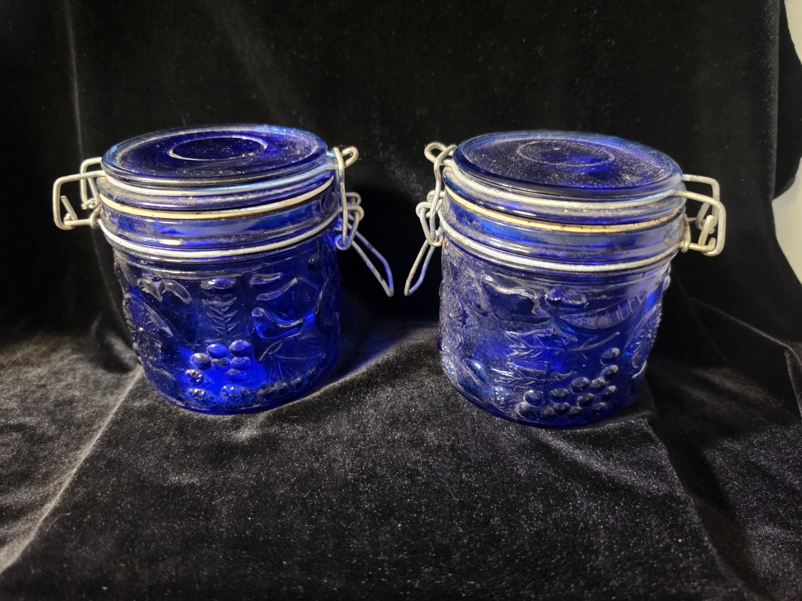 Vinatage Cobalt Blue Embossed Glass Jars With Locking Lids.
