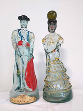 COPPIA VECCHIE BOTTIGLIE BRANDY VETRO STATUE NOGUERAS COMAS, MATADOR E SENORITA