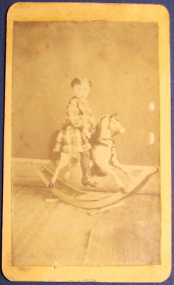 East St. Charles, Illinois, child on a rocking horse, C. T. Hunt, photographer