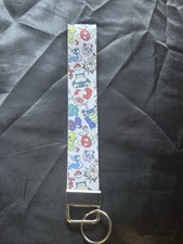 Pokey Man Wristlet. Random Lanyard of All The Evaluations New In Package