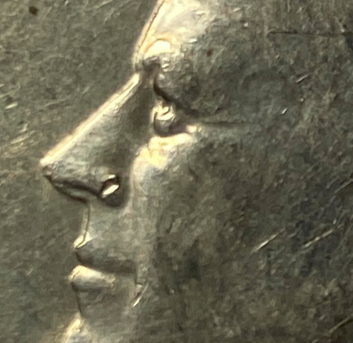 1972 Kennedy Half Dollar Error - Die break Kennedy's nose (looks