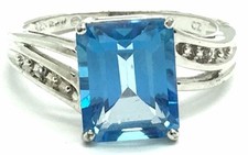 Sterling Silver Emerald Cut Swiss Blue Topaz CZ Accent Twist Band Cocktail Ring