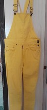 yellow summer jumpsuit for a girl with iron buttons