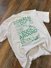 T-shirt Zara/Disney 'Donald Duck in Around the Clock' bianco sporco usata in ottime condizioni M