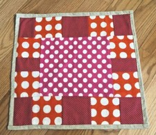 Quilted table topper or wall decoration15.5 x 14.5 handmade white circles on red