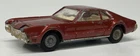 Vintage 1960s Corgi Toys Oldsmobile Toronado Rust color Very used condition.