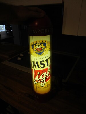 AMSTEL LIGHT BEER LIGHTED MOTION BULLET WALL MOUNT BACK BAR SIGN WORKS GREAT