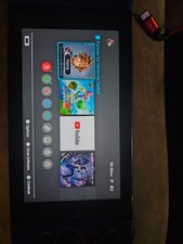 nintendo switch console with dock and charging cord and travel case and zelda co