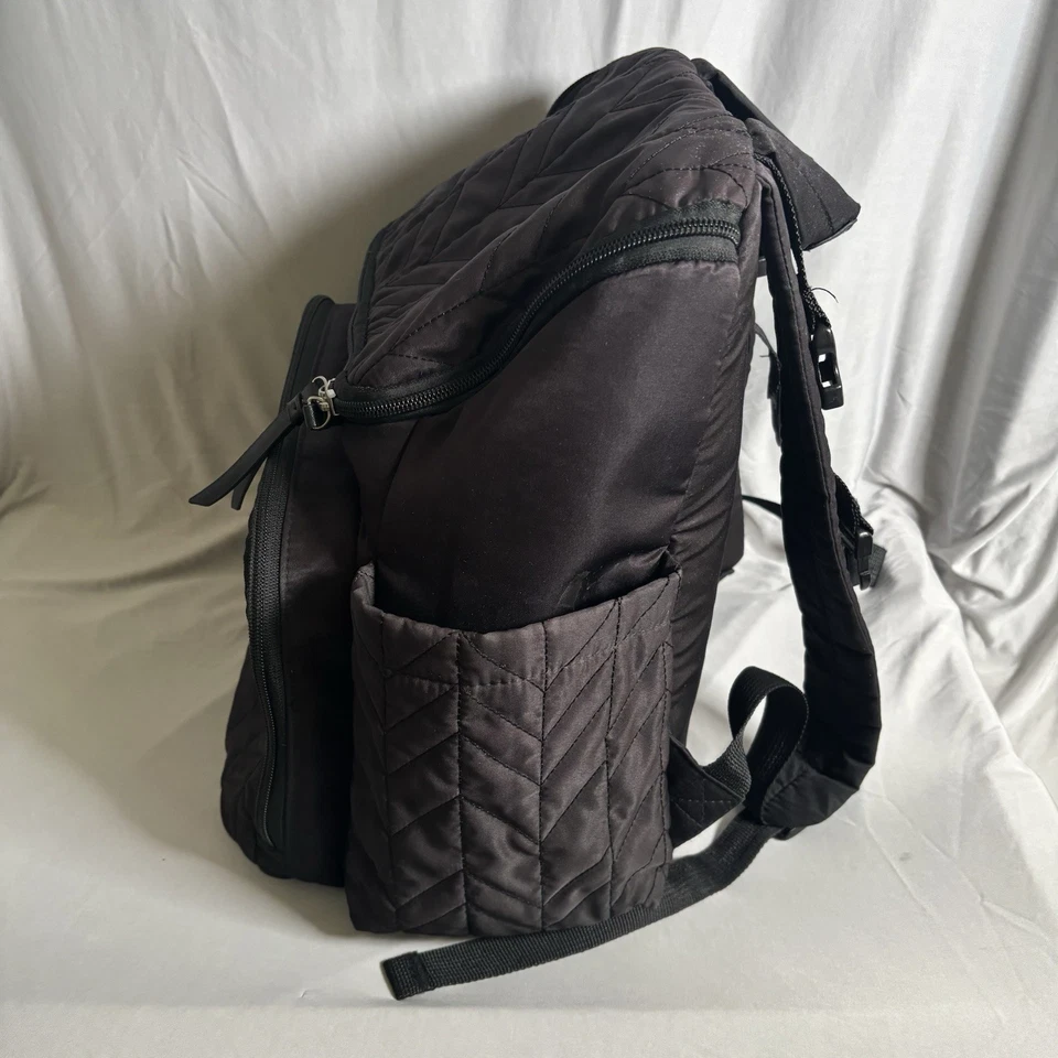 Mochila Bolsa de Pañales Skip Hop Negra Forma Acolchada Bolsillos con Cremallera Correas Ajustables Foto 2 de 4