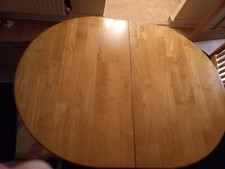 Solid wood extending dining table. Great Condition