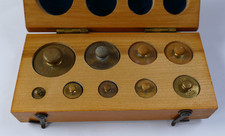 Brass Apothecary weights in original fitted  wooden box. very good condition