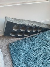 Solid slate wine rack holds 8 bottles. 89cmx29 cm
