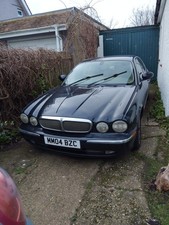 Jaguar X350 V6 3.OL 2004 Black With Biscuit Leather Interior.