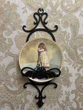 PAIR OF CAST IRON WALL MOUNTED PLATE/PICTURE HOLDERS