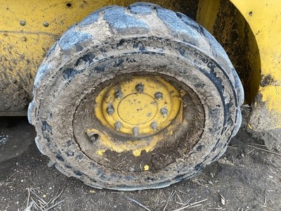 Gehl R165 Left/Driver Tire and Rim - Used