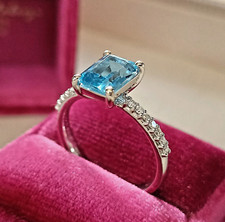 Anello oro Bianco 18 kt  con TOPAZIO AZZURRO taglio smeraldo e DIAMANTI oro 750