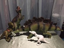 Four Rubber Dinosaurs Toys Lot
