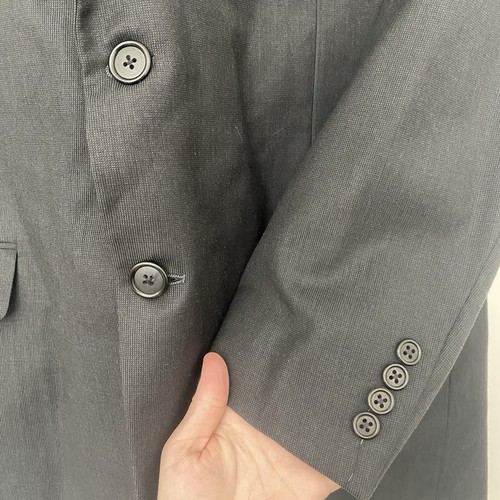 Gray Hickey Freeman men's 100% Super 130’s wool blazer with two-button front, notch lapel, and five-button cuffs on right sleeve.