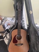 used Left Handed 12 string acoustic guitar Seagull playable/ selling for parts