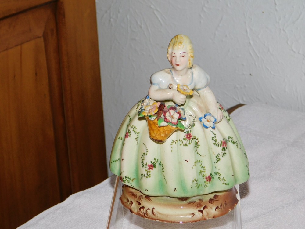 figurines porcelain Italy porcelain girl holding a basket of flower.