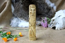 Small wooden figurine Domovoy. Slavic home spirit Domovoy statue. Brownie statue
