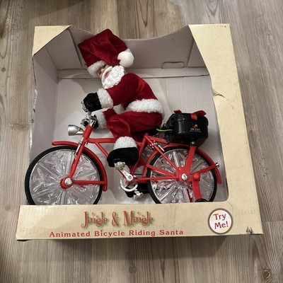 Animated Santa Claus Riding a Bicycle 12'' Plays Music Lights Up and Wheel Moves