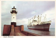 Postcard MN Duluth Canal Harbor North Pier Light lighthouse Cargo Vessel Ship