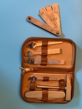 Vintage tool kit in leather portfolio with gauge tool and vintage pocket knife.