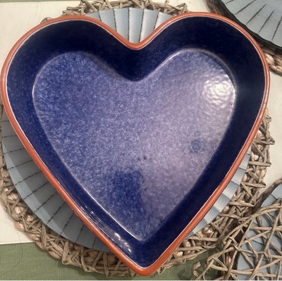 Beautiful blue heart-shaped ceramic dish with a contrasting rim.