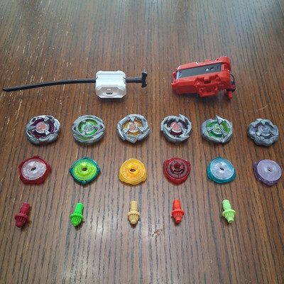 6 Beyblades and 2 Launchers
